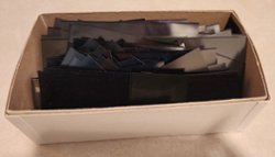 500+ black mounts (some used) in box